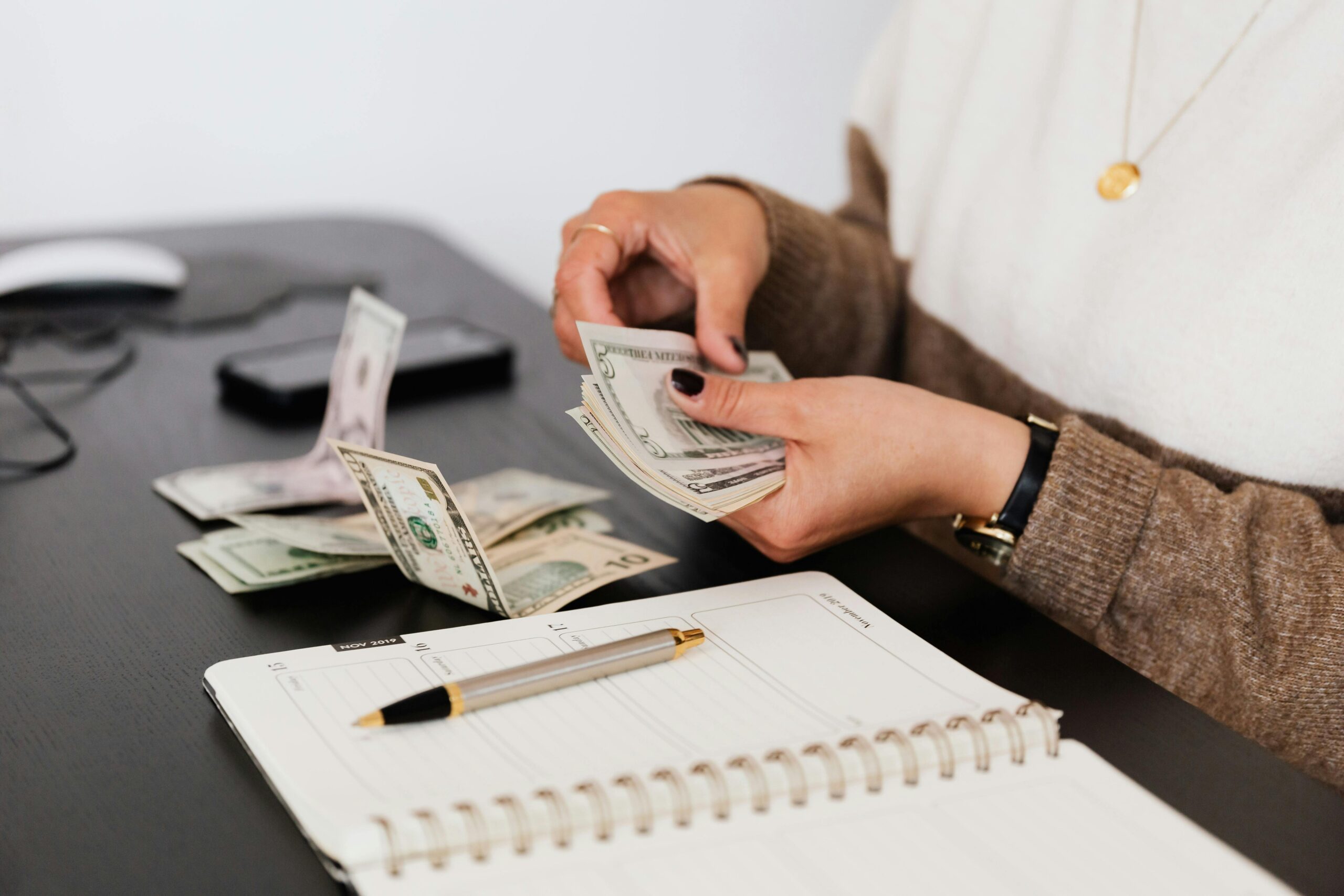 Woman paying closing costs on a loan